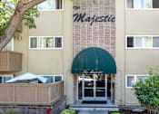 Thumbnail 3 of 16 - the entrance to the majestic building with a green awning