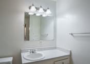 Thumbnail 8 of 16 - an empty bathroom with a sink and a mirror