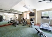 Thumbnail 14 of 20 - the gym at our apartments has cardio equipment and a tv