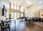 Thumbnail 10 of 20 - spacious community room with dining tables