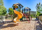 Thumbnail 9 of 20 - the playground at the  apartments with a slide