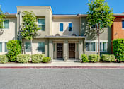 Thumbnail 5 of 20 - the front of a house with a street in front of it
