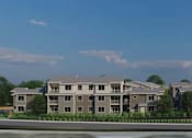 Thumbnail 2 of 4 - a rendering of an apartment building on a street