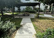 Thumbnail 26 of 44 - a picnic area in a gazebo with a playground next to it