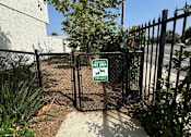 Thumbnail 42 of 44 - a gate with a sign on it in front of a fence