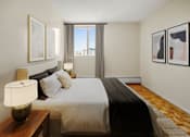 Thumbnail 10 of 14 - A bedroom with a large bed and a window overlooking the city.