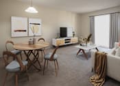 Thumbnail 2 of 10 - A living room with a round wooden table and chairs, a television, and a coffee table.