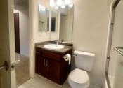 Thumbnail 22 of 29 - a bathroom with a toilet and a sink