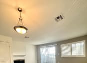 Thumbnail 17 of 29 - an empty living room with wood flooring and a fireplace