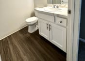 Thumbnail 14 of 29 - a bathroom with a toilet sink and mirror