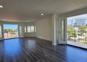 Thumbnail 50 of 52 - an empty living room with a view of the city