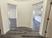 Thumbnail 34 of 52 - a view of the hallway from the living room into the kitchen