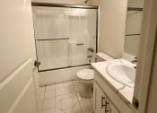 Thumbnail 28 of 29 - a bathroom with a sink toilet and shower