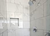 Thumbnail 43 of 52 - a large shower in a marble tiled bathroom