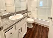 Thumbnail 13 of 29 - an empty bathroom with a sink toilet and shower