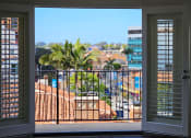 Thumbnail 41 of 52 - the view from the window of an apartment in a building with palm trees