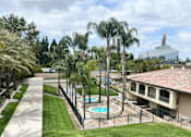 Thumbnail 40 of 40 - A pool surrounded by a fence and trees.