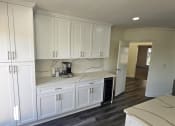 Thumbnail 45 of 52 - a recent kitchen remodel with white cabinets and black appliances