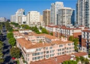 Thumbnail 4 of 30 - Lindbrook Manor Apartments Courtyard from a Drone