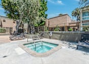 Thumbnail 7 of 22 - our apartments have a hot tub and lounge chairs in the pool
