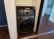 Thumbnail 17 of 40 - a washing machine and dryer in a closet