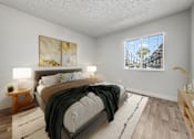 Thumbnail 29 of 32 - A bedroom with a large bed and a painting on the wall.