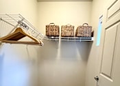 Thumbnail 15 of 29 - White closet with hanger at Wilsonville Summit Apartments, Wilsonville , Oregon