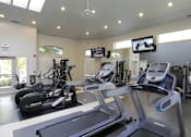 Thumbnail 20 of 29 - Gym with treadmills at Wilsonville Summit Apartments, Oregon