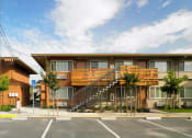 Thumbnail 8 of 11 - a building with a wooden staircase in front of it