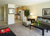Thumbnail 10 of 11 - a living room with a couch a chair and a table