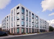 Thumbnail 1 of 17 - a new apartment building on a city street