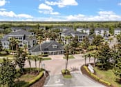 Thumbnail 1 of 15 - A large, well-maintained housing development with a central courtyard.
