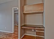 Thumbnail 62 of 72 - A room with a built in shelf and drawers.
