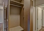 Thumbnail 28 of 72 - A room with a closet and a door.