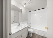 Thumbnail 20 of 33 - a bathroom with a sink toilet and a tub