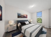 Thumbnail 5 of 33 - a bedroom with a bed and a window