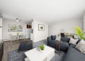 Thumbnail 1 of 33 - a living room with a gray couch and a white table