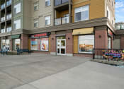 Thumbnail 18 of 72 - an empty sidewalk in front of a large apartment building