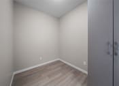 Thumbnail 10 of 72 - an empty room with wood flooring and white walls
