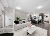 Thumbnail 1 of 25 - a living room with a couch and a table