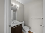 Thumbnail 12 of 72 - an empty bathroom with a toilet sink and mirror