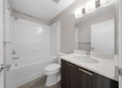 Thumbnail 26 of 48 - a bathroom with a toilet sink and shower and a mirror