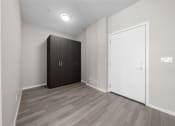 Thumbnail 48 of 48 - an empty room with a wardrobe and a door