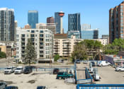 Thumbnail 42 of 48 - an empty parking lot in the city with tall buildings