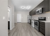 Thumbnail 45 of 48 - the living room of our studio apartment atrium with stove refrigerator and microwave
