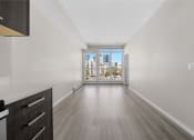 Thumbnail 33 of 48 - the living room of a condo with a view of the city
