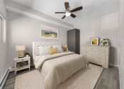 Thumbnail 24 of 48 - a bedroom with a bed and a ceiling fan