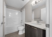 Thumbnail 37 of 48 - a bathroom with a toilet sink and shower and a mirror