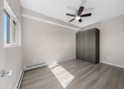 Thumbnail 39 of 48 - an empty room with a closet and a ceiling fan