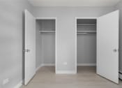 Thumbnail 21 of 33 - an empty room with white doors and a closet